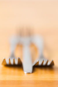Close-up of guitar on wooden table