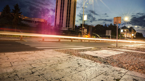 Illuminated city street at night