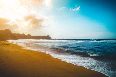 Scenic view of beach against sky