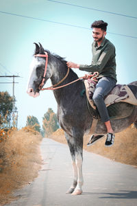 Man riding horse