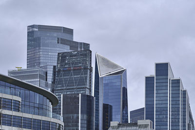 Modern buildings in city against sky