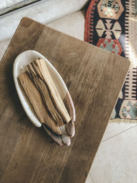 High angle view of bread on cutting board