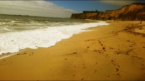 Scenic view of beach against sky