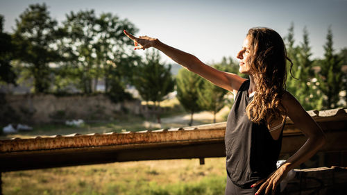 Woman points with her hand