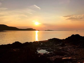 Scenic view of sea against sky during sunset