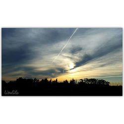 Scenic view of landscape against sky at sunset