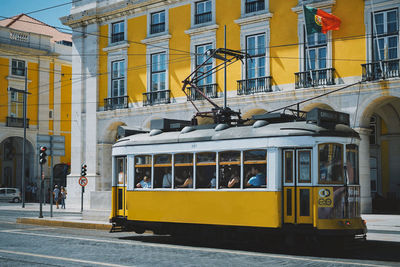 Yellow bus on street in city