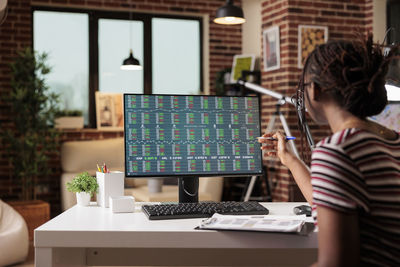 Woman using laptop at table