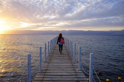 Girl on the catwalk at sunset