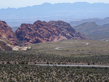 Scenic view of landscape and mountains against sky