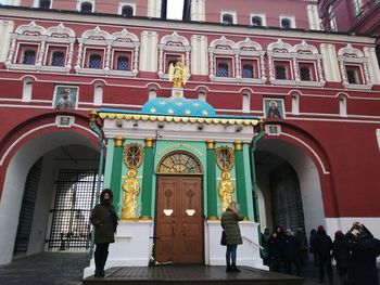 People walking in front of building