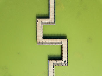 Low angle view of green wall against building