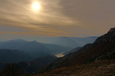 Scenic view of mountains against sky during sunset