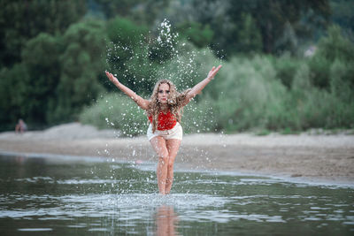 Full length of boy on water