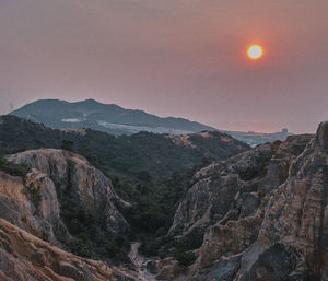 Scenic view of mountains at sunset