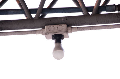 Low angle view of electric lamp against sky