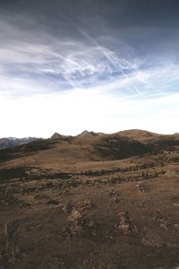 Scenic view of landscape against cloudy sky