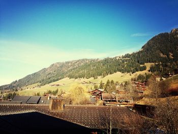 Scenic view of mountains against blue sky