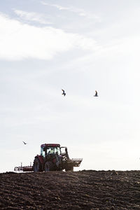 Tractor plowing field