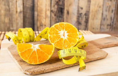 Close-up of orange fruits on cutting board