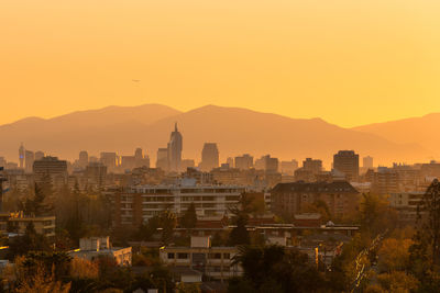 Cityscape against sky during sunset