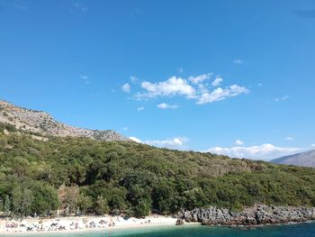 Scenic view of landscape against blue sky