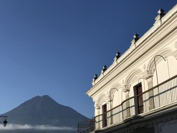  view of historical building and volcano in the background in  antigua guatemala 
