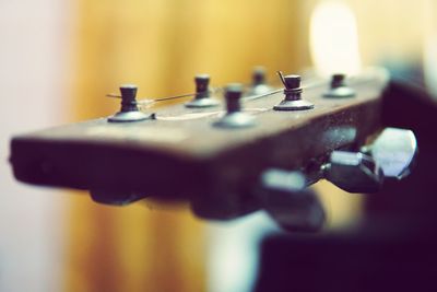 Close-up of guitar on table