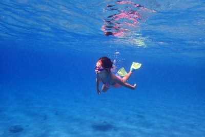 Girl swimming in sea