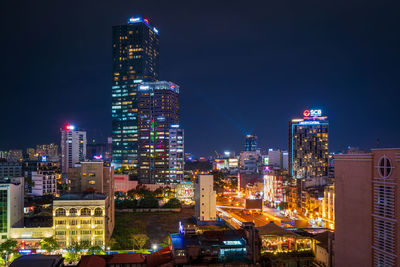 Illuminated buildings in city at night