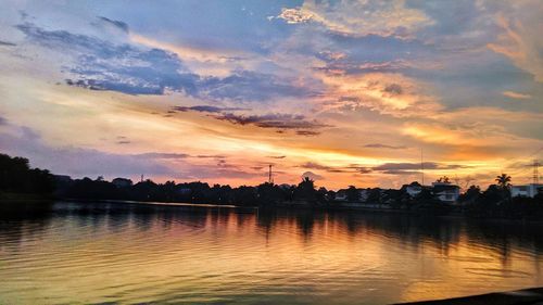 Scenic view of lake against orange sky