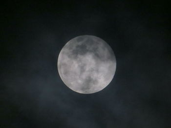 Low angle view of moon against sky at night