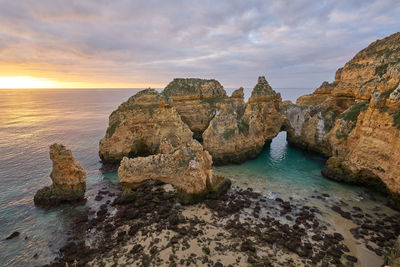 Praia do amado beach at sunset in costa vicentina, portugal