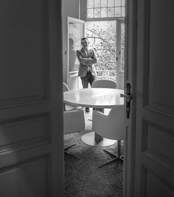 Full length of woman standing on bench