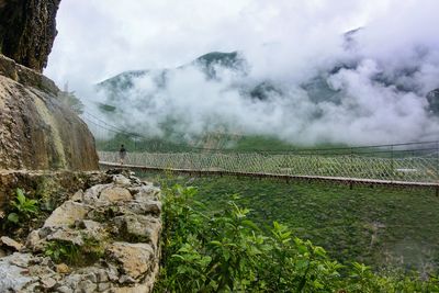 Scenic view of mountains in foggy weather