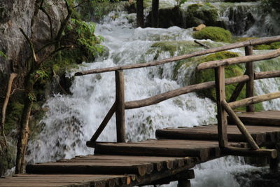 Wooden footbridge over water