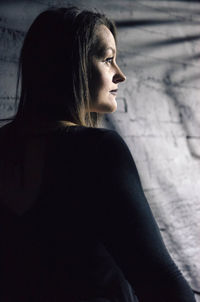 Portrait of young woman looking away