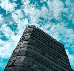 Low angle view of incomplete building against sky