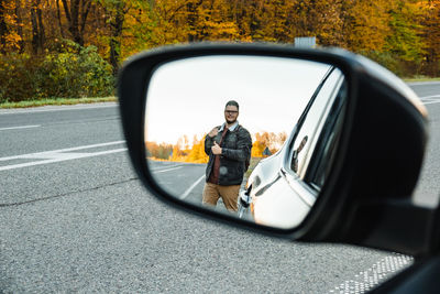 Reflection of road on side-view mirror