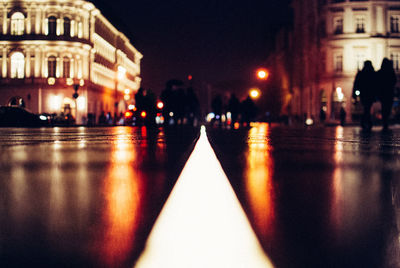 Light trails on road in city at night