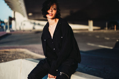 Young woman on road in city