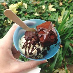 Cropped image of person holding ice cream