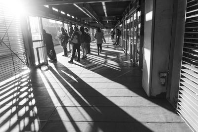 Group of people walking on tiled floor