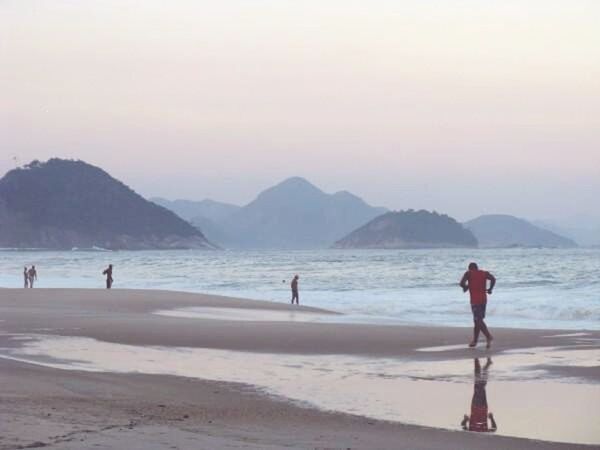 beach, sea, water, shore, sand, leisure activity, mountain, vacations, lifestyles, scenics, beauty in nature, wave, tranquil scene, nature, enjoyment, tranquility, horizon over water, clear sky, sky