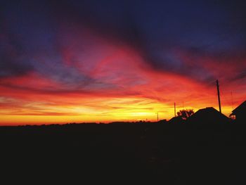 Silhouette of landscape against dramatic sky
