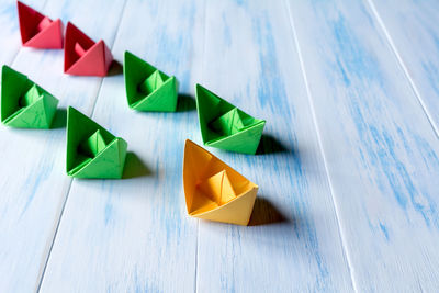 High angle view of paper boats on table