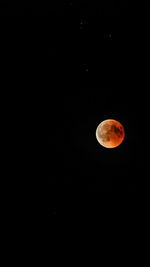 Low angle view of moon against sky at night