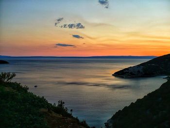 Scenic view of sea against sky at sunset