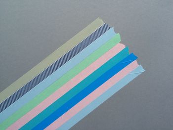 Directly above shot of colorful adhesive tapes on gray table