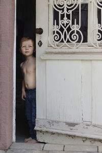 Boy near open door